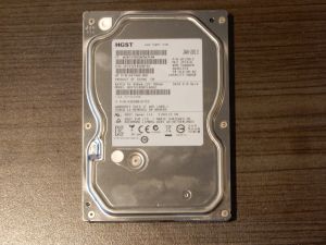 Top lid of a Hitachi HDS721050CLA662 hard drive with the HGST logo.