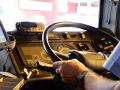 The steering wheel and controls of an L94UB.